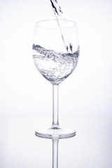 The glass is filled with clear transparent water.