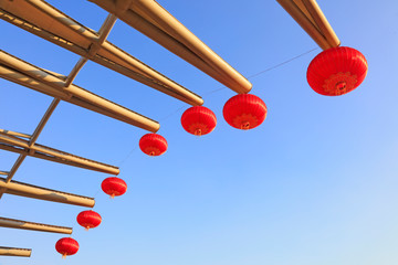 Red lanterns on steel beams