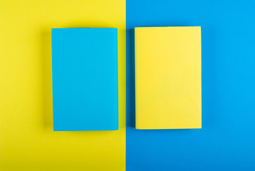 Blue and yellow books Mock up on a yellow-blue background. Flat Lay, Copy space, space for text, top view