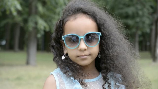 child girl sunglasses outdoors