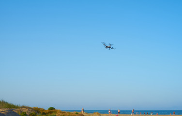 Drone flying in the beach sky in summer