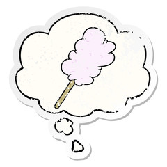 cartoon candy floss and thought bubble as a distressed worn sticker