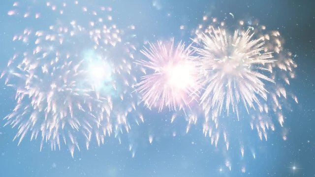 Colourful fireworks on evening blue sky copy space background.