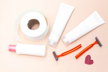 Personal hygiene : Toilet paper roll and shaver and intimate lotion and shampoo, wooden stick, shaver and intimate lotion