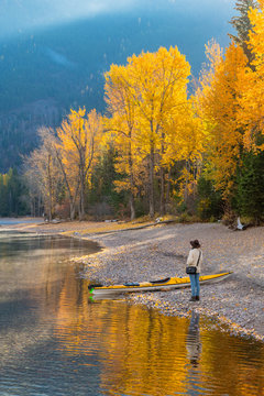 Woman on the shore of Lake McDonald, Glacier National Park, Montana