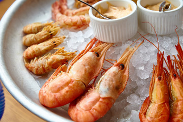 Different shrimp( nerd, bear and others), ice on ice with sauce.
