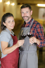man and women coworkers attentively looking at the camera