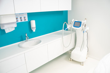 New salon with interesting interior desigh and electronic equipment in massage clinic