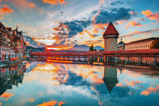 Sunset in historic city center of Lucerne with famous Chapel Bridge and lake Lucerne (Vierwaldstattersee), Canton of Lucerne, Switzerland
