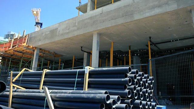 Construction Site with stacks of pipes