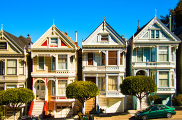 San Francisco residential street with The Painted Ladies, rows of victorian wooden houses at Alamo...