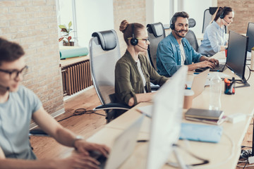 Young male worker is working in the call center