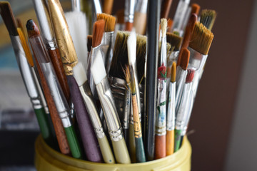 Art paint brushes. colorful brushes in pot