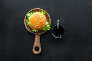 National american food concept with burgers and drink on black background top view