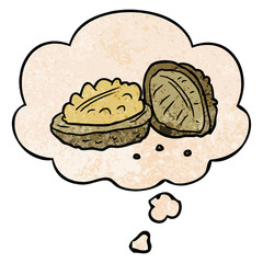 cartoon walnuts and thought bubble in grunge texture pattern style