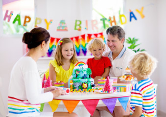 Child birthday party cake. Family with kids.