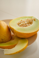 ripe yellow melon on wooden table