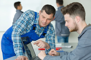 Obraz premium portrait of mechanical student with teacher