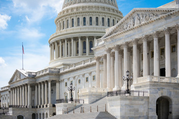 Afternoon view of the US Capitol Building under soft blue sky in Washington DC, USA
