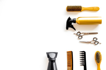 Hairdresser equipment for cutting hair and styling with combs, sciccors, brushes on white background top view copyspace