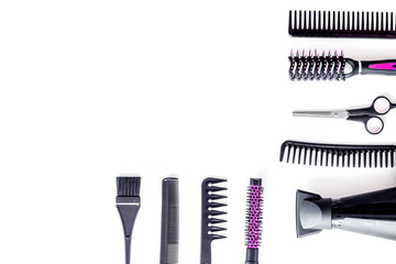 Hairdresser equipment for cutting hair and styling with combs, sciccors, brushes on white background top view copyspace