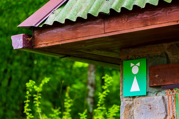 Public Restroom. White Female symbol on green background on Toilet Sign