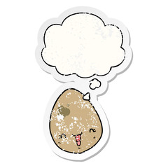 cartoon egg and thought bubble as a distressed worn sticker