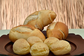 french bread and cheese bread on the plate with red background