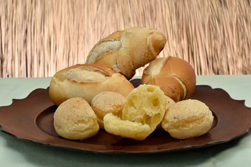 french bread and cheese bread on the plate with red background