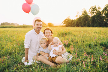 Portrait of family outdoors on nature.
