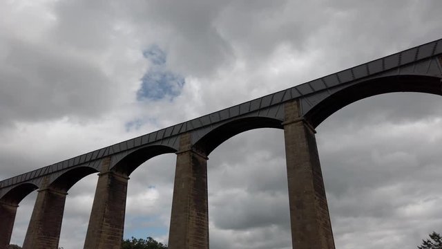 Pontcysyllte Aqueduct arch bridge canal waterway crossing low angle slow pull back.