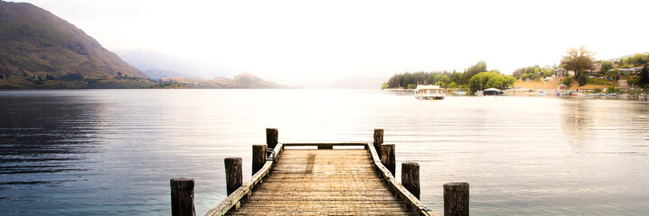 wooden pier on the lake at sunrise sunset