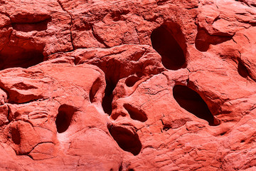 Sandstone background and texture colored in coral color