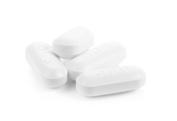 white pills  tablets on a white background. full depth of field