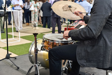 Valencia, Spain - June 20, 2019: Musician playing jazz to the battery hired to entertain the...