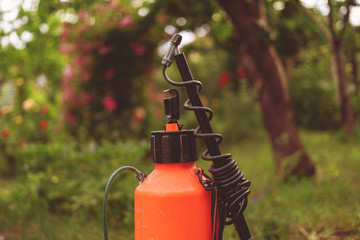 orange plastic sprayer plant bottle with desinfection for garden trees