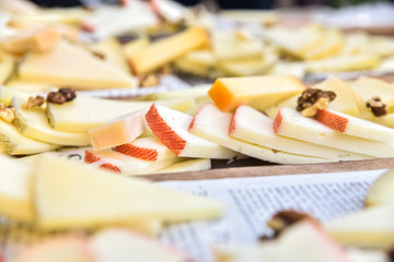 Buffet of cheeses of many types on a table served in Mediterranean diners.