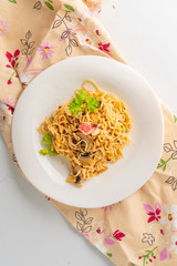 cooked hot meal or dish with spaghetii crab meat mushrooms and spice