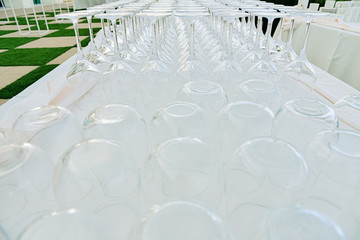 Business events background, catering company places cups and empty glasses to serve drinks.