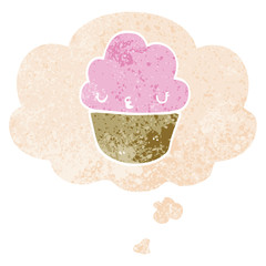 cartoon cupcake with face and thought bubble in retro textured style