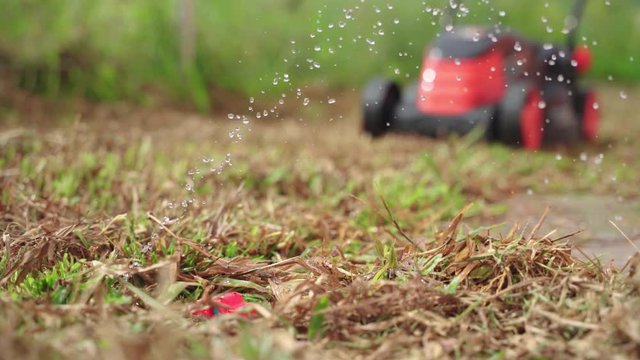 Busted and broken water pipe in yard from lawn mower