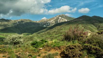A stunning mountain view. Springtime landscape with meadow, mountains and sky. Zanzegur Mountains near Meghri village. Armenia