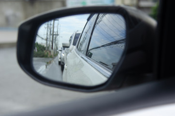 Fototapeta premium Car in the side mirror