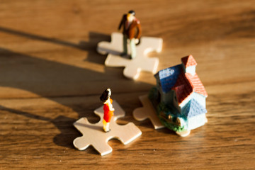 Puzzle with people, house, woman's choice