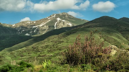 A stunning mountain view. Springtime landscape with meadow, mountains and sky. Zanzegur Mountains near Meghri village. Armenia