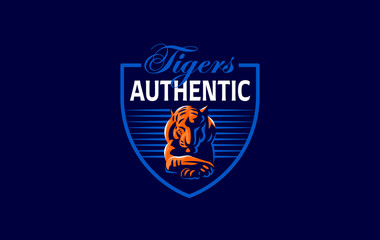 A tiger lies with its head down