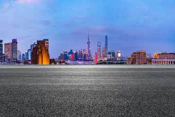 Shanghai skyline panoramic view with asphalt highway at night,China