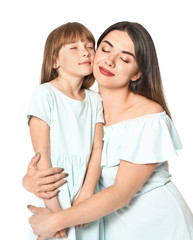 Portrait of happy mother and daughter on white background