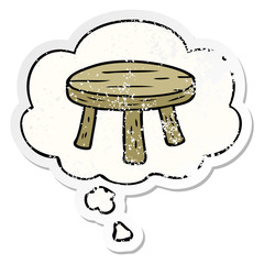 cartoon small stool and thought bubble as a distressed worn sticker
