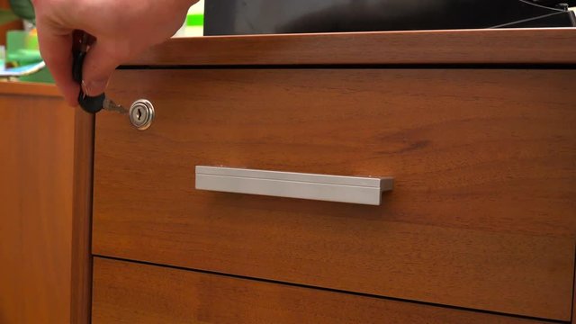 a drawer in the bedside table opens with a small key.
